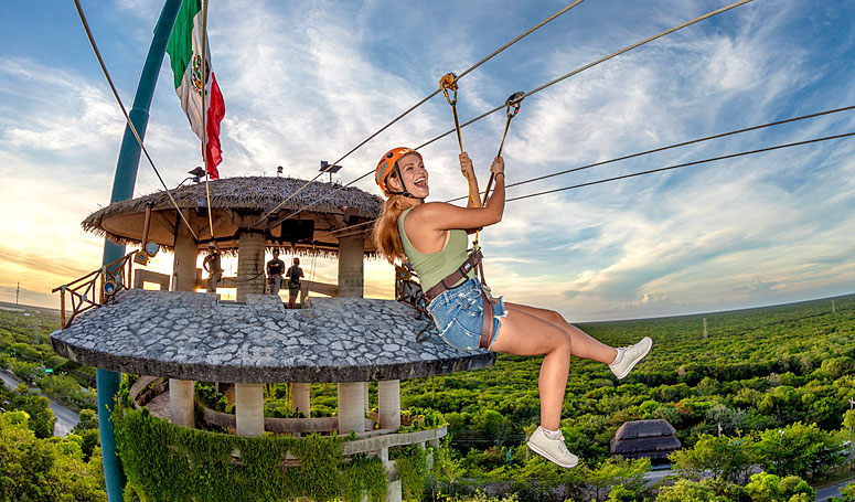 Flying in ziplines with the view of the jungle and the Caribbean Sea