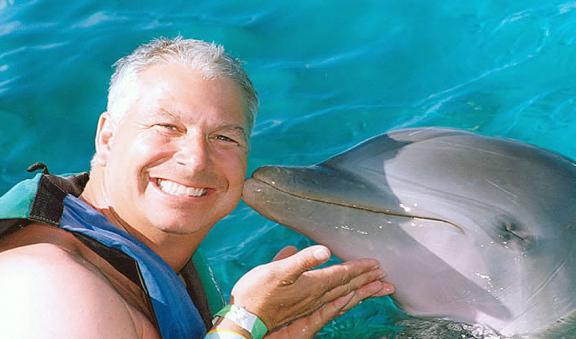 kissing a dolphin