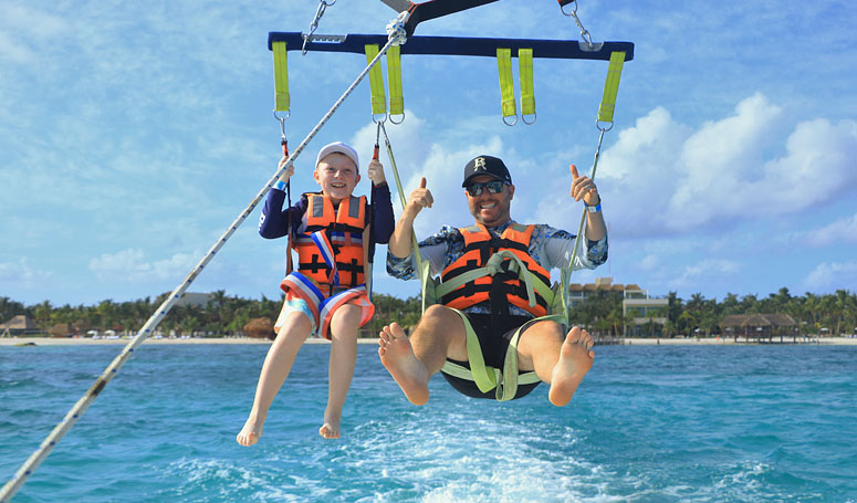 Couples riding Parasailing